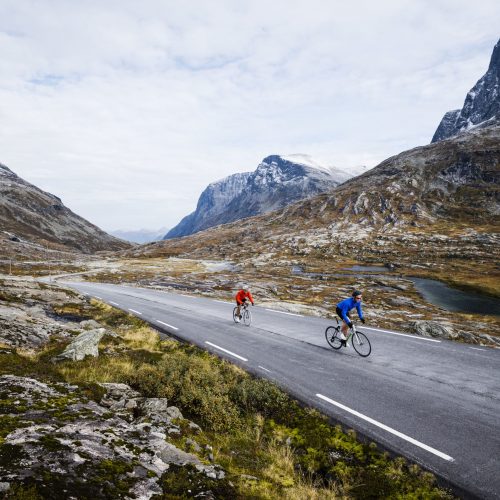 Two people biking